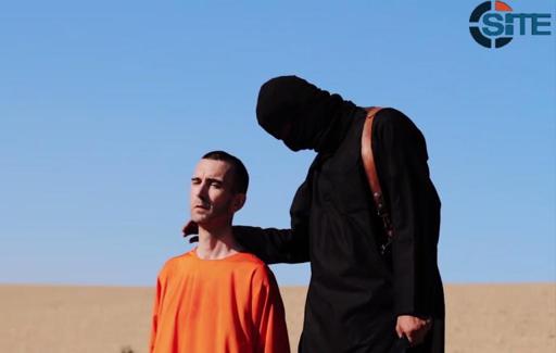 Britânico David Haines momentos antes de sua execução por um militante do Estado Islâmico (Foto de HO/SITE Intelligence Group/AFP)